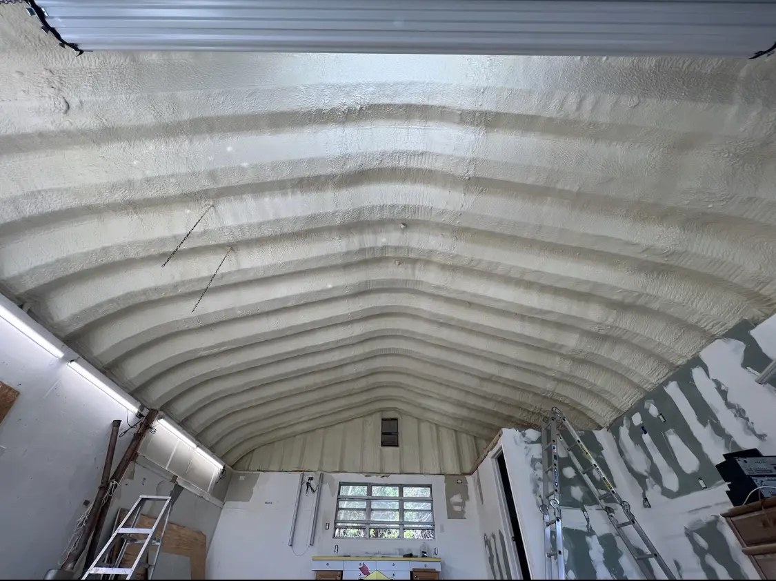 Spray polyurethane foam applied to the underside of a metal roof deck in Columbia